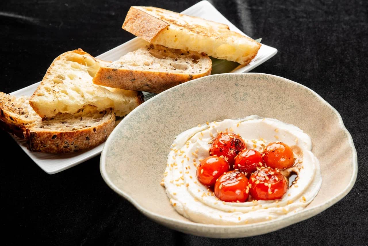 <span style="font-weight: 700">Craft bread with cheese cream and baked cherry tomatoes</span><br>